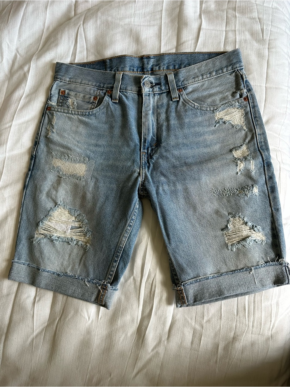 Levi’s 511 Distressed Light Blue Denim Shorts